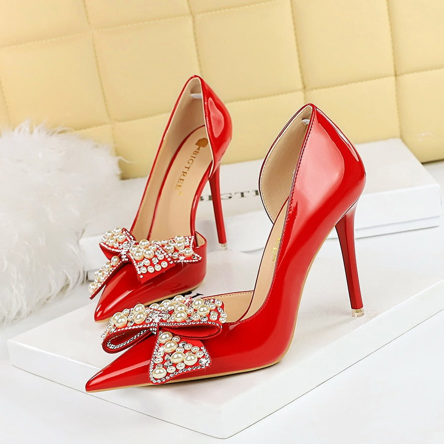 Pointed pearl rhinestone bow pumps