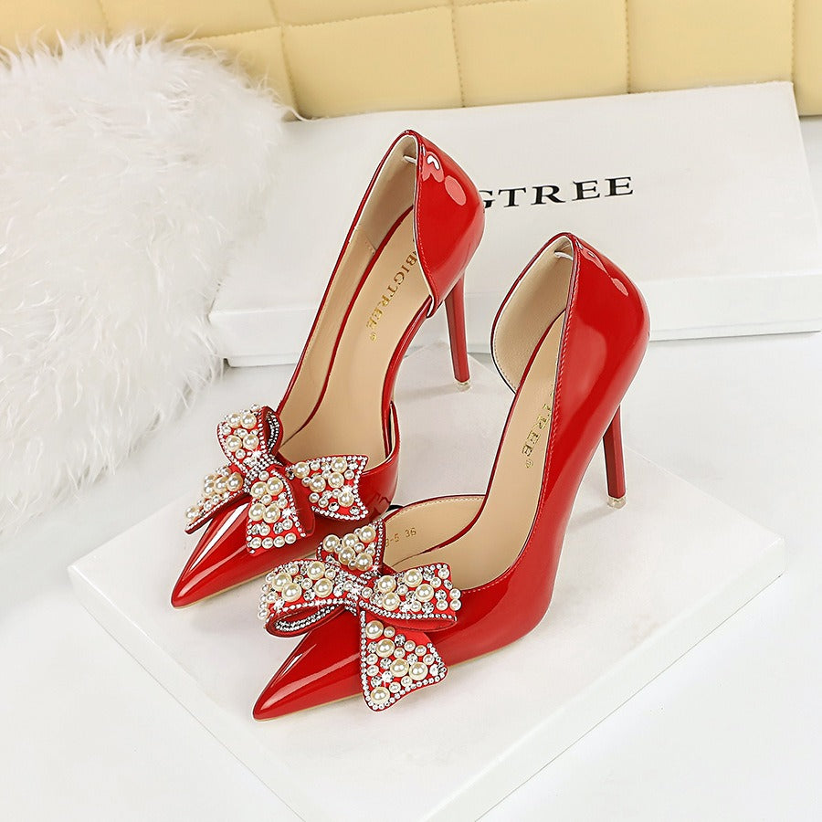 Pointed pearl rhinestone bow pumps